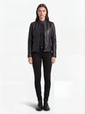 Female model wearing Maverick Maeve leather café racer jacket, slim fit, styled with black skinny jeans and black combat boots. Maverick Jacket.