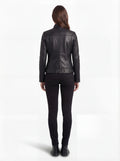 Rear view of female model wearing Maverick Maeve leather café racer jacket showing tailored back fit and clean shoulder yoke. Maverick Jacket.