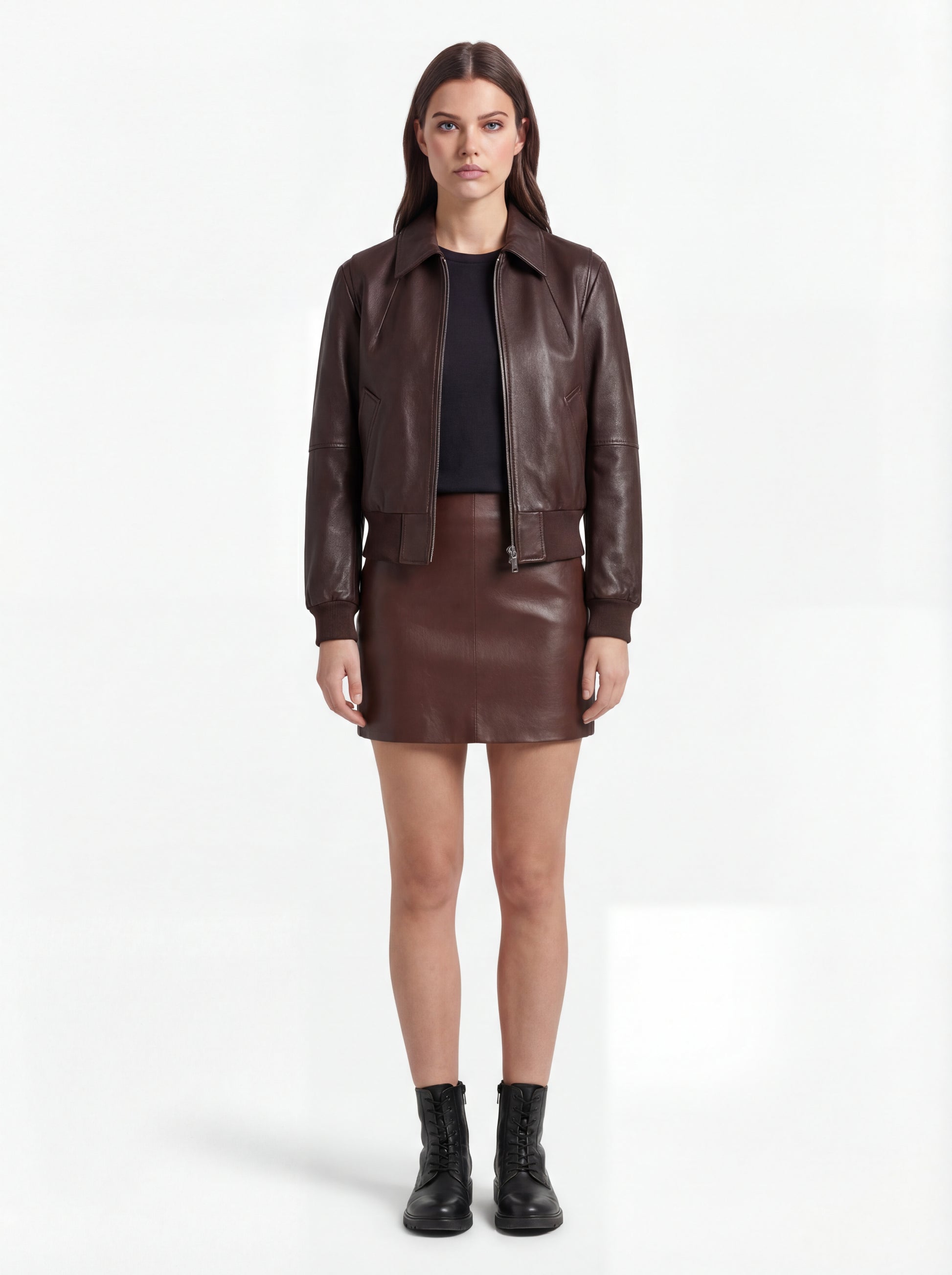 Female model wearing Maverick Isla leather bomber jacket, relaxed fit, styled with Maverick Orla brown leather mini skirt. Maverick Jacket.