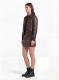 Side profile of Maverick Isla bomber jacket showing long sleeve structure and ribbed cuff detail. Maverick Jacket.
