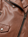 Macro shot of grained tan leather texture and silver zipper lapel detail on biker jacket. The Stella by Maverick Jacket.