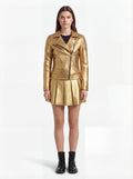 Female model wearing Maverick Aurora leather biker jacket, slim fit, styled with Maverick Poppy metallic gold pleated leather skirt. Maverick Jacket.