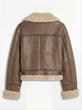 Rear view of brown leather shearling aviator jacket showing vertical center seam and adjustable side waist buckles. The Amelia by Maverick Jacket.