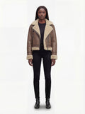 Female model wearing Maverick Amelia aviator jacket, relaxed fit, styled with black skinny jeans and leather ankle boots. Maverick Jacket.
