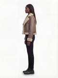 Side profile of Maverick Amelia aviator jacket showing long leather sleeves with fur cuffs and boxy silhouette. Maverick Jacket.