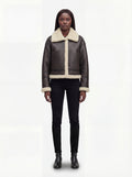 Female model wearing Maverick Thea aviator jacket, relaxed fit, styled with black skinny jeans and leather boots. Maverick Jacket.