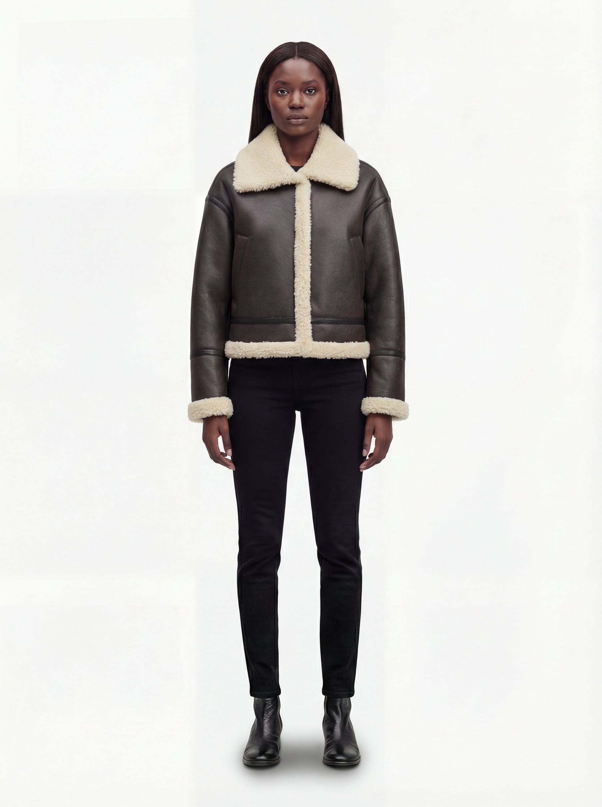 Female model wearing Maverick Thea aviator jacket, relaxed fit, styled with black skinny jeans and leather boots. Maverick Jacket.