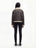 Rear view of female model wearing Maverick Thea aviator jacket showing structured shoulder fit and clean back paneling. Maverick Jacket.