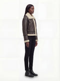 Side profile of Maverick Thea aviator jacket showing leather sleeve length and boxy silhouette. Maverick Jacket.