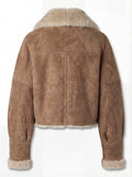Rear view of tan suede shearling aviator jacket showing vertical center seam and cream fur hem. Maverick Anya.