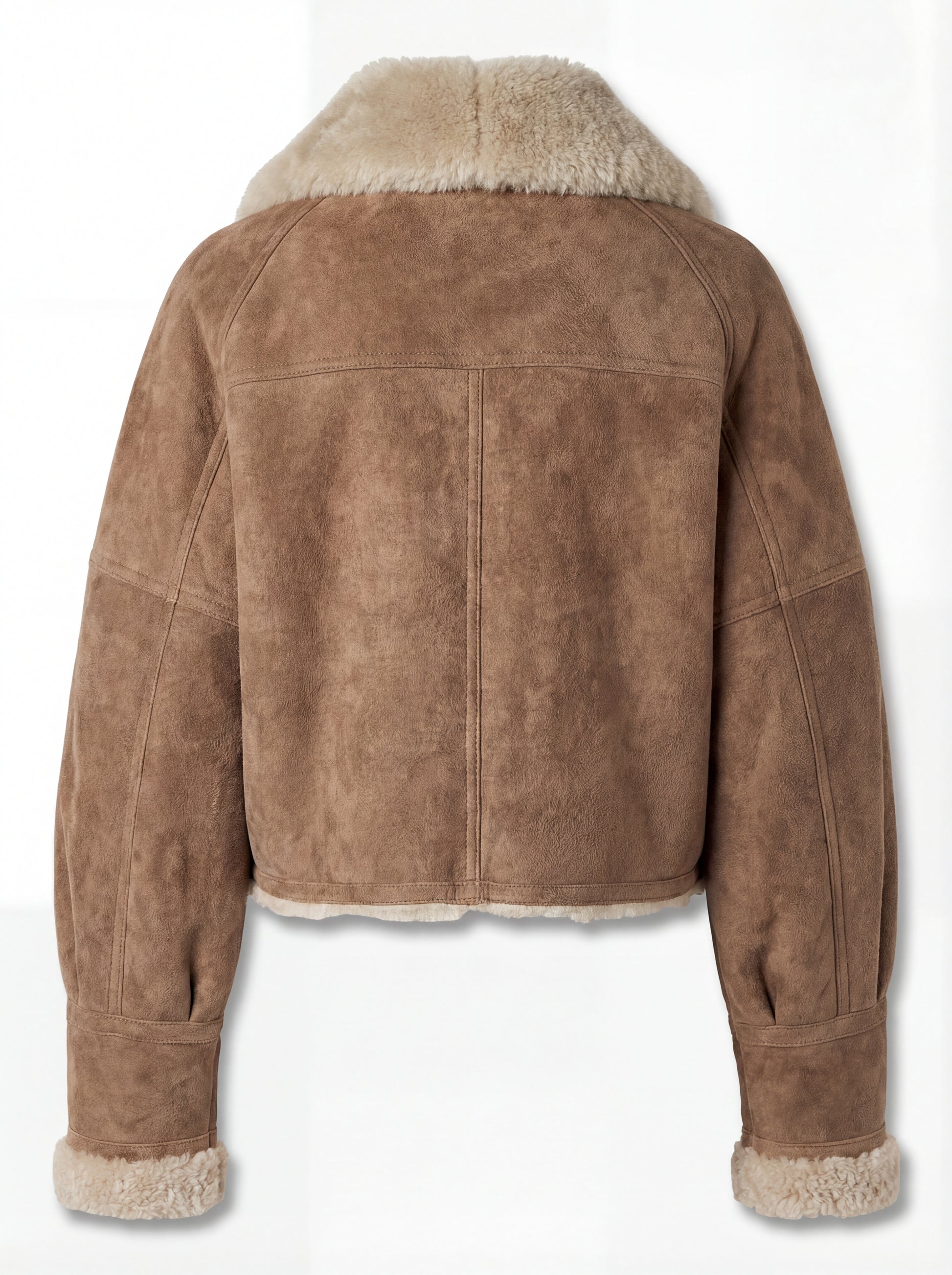 Rear view of tan suede shearling aviator jacket showing vertical center seam and cream fur hem. Maverick Anya.