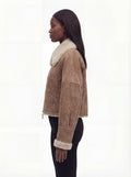 Side profile of Maverick Anya aviator jacket showing shearling cuff detail and boxy hip-length silhouette. Maverick Anya.