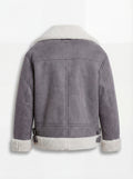 Rear view of grey suede shearling aviator jacket showing vertical center seam and buckled side waist tabs. Maverick Esme.