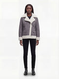 Female model wearing Maverick Esme shearling aviator jacket, relaxed fit, styled with black skinny jeans and black leather ankle boots. Maverick Esme.