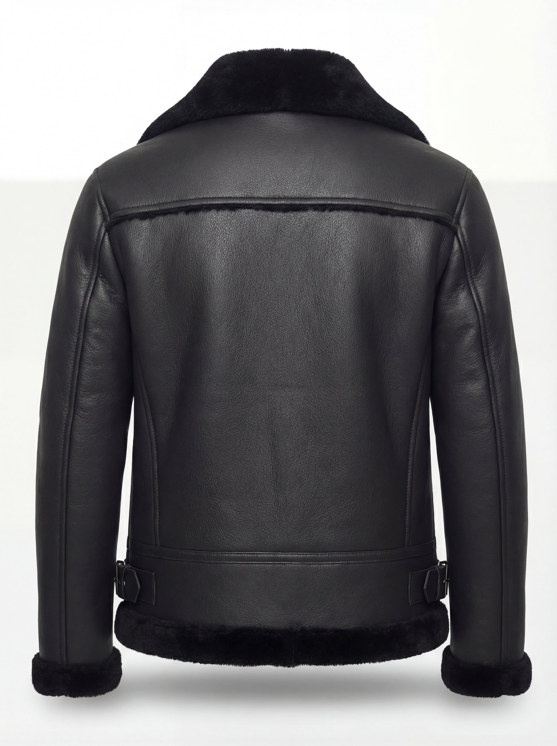 Rear view of black leather aviator jacket showing horizontal yoke paneling and buckled side waist tabs. Maverick Nova.
