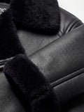 Macro shot of pebbled black leather texture and plush black shearling collar on aviator jacket. Maverick Nova.