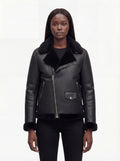 Female model wearing Maverick Nova shearling aviator jacket, tailored fit, styled with black skinny jeans. Maverick Nova.
