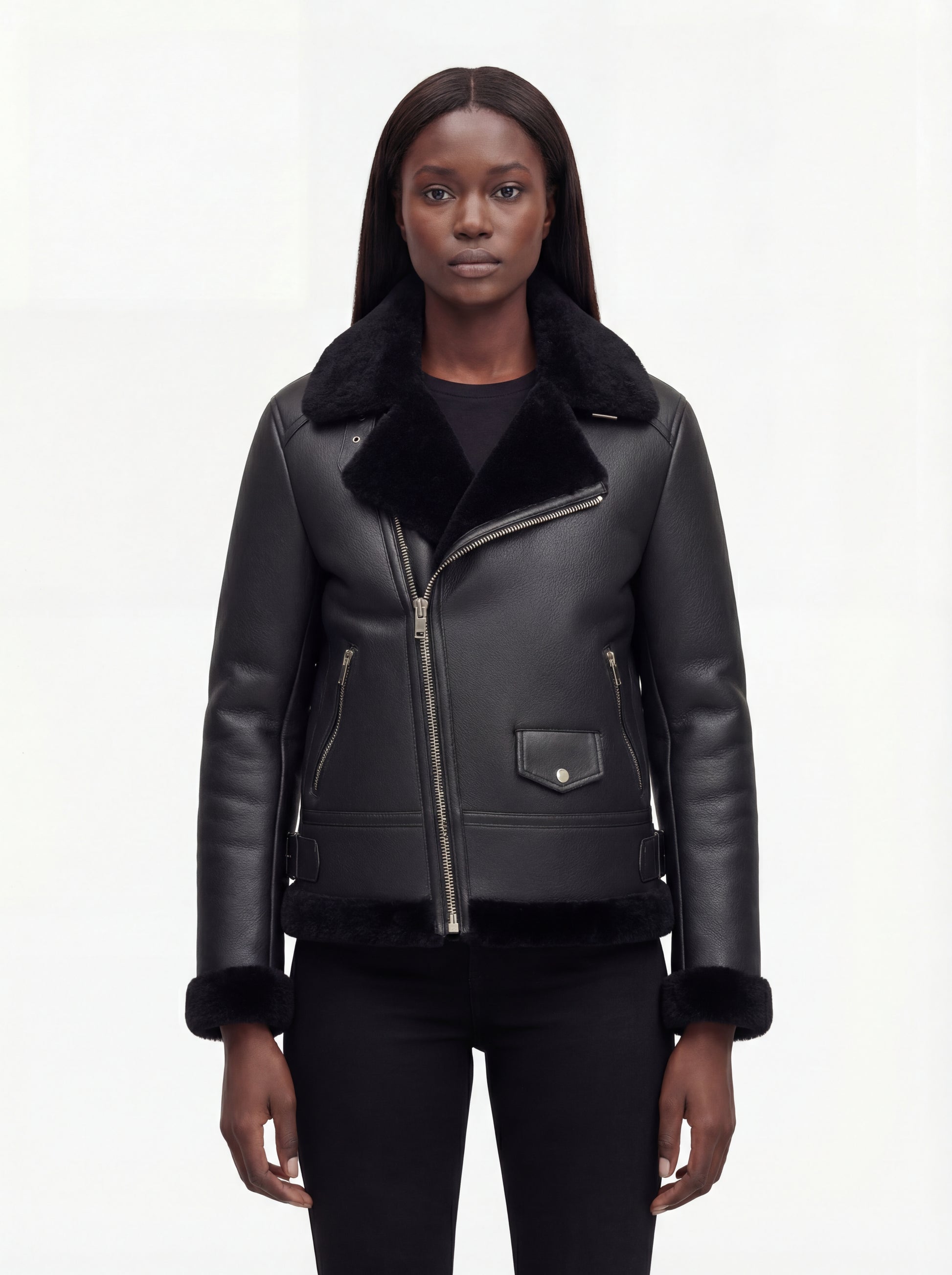 Female model wearing Maverick Nova shearling aviator jacket, tailored fit, styled with black skinny jeans. Maverick Nova.