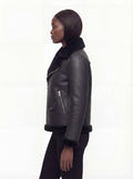 Side profile of Maverick Nova aviator jacket showing thick shearling cuffs and hip-length silhouette. Maverick Nova.