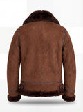 Rear view of brown suede shearling aviator jacket showing vertical center seam and leather waist adjusters. The Eliza by Maverick Jacket.