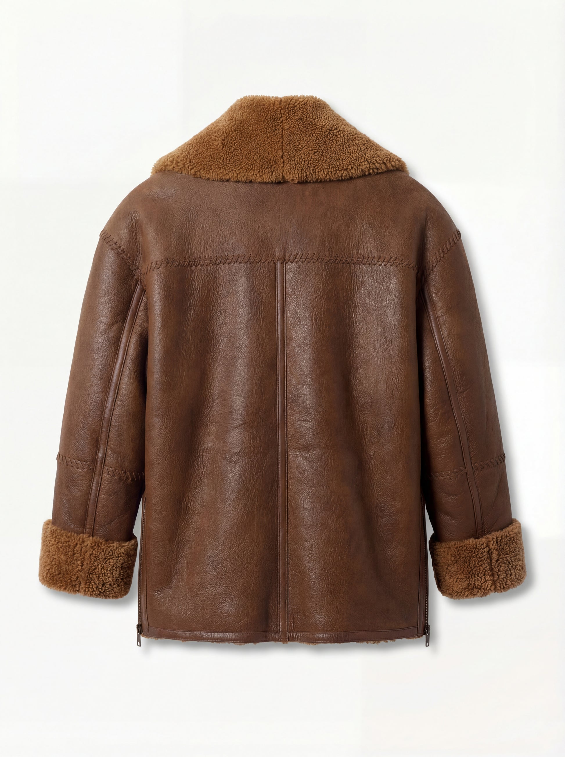 Rear view of brown leather shearling jacket showing horizontal whipstitch yoke and vertical center seam. Maverick Greta.