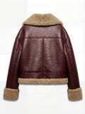 Rear view of burgundy leather shearling jacket showing T-shaped back yoke paneling and shearling hem. Maverick Faye.