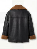 Rear view of black and tan shearling jacket showing vertical center seam and braided sleeve seams. Maverick Noa.
