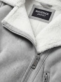 Macro shot of soft grey suede texture and silver zipper hardware on biker jacket. The Selene by Maverick Jacket.