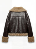 Rear view of brown leather shearling jacket showing T-shaped back yoke paneling and shearling hem. Maverick Faye.