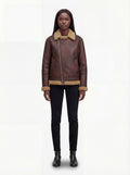 Female model wearing Maverick Sierra distressed aviator jacket, relaxed fit, styled with black skinny jeans and black leather boots. Maverick Sierra.