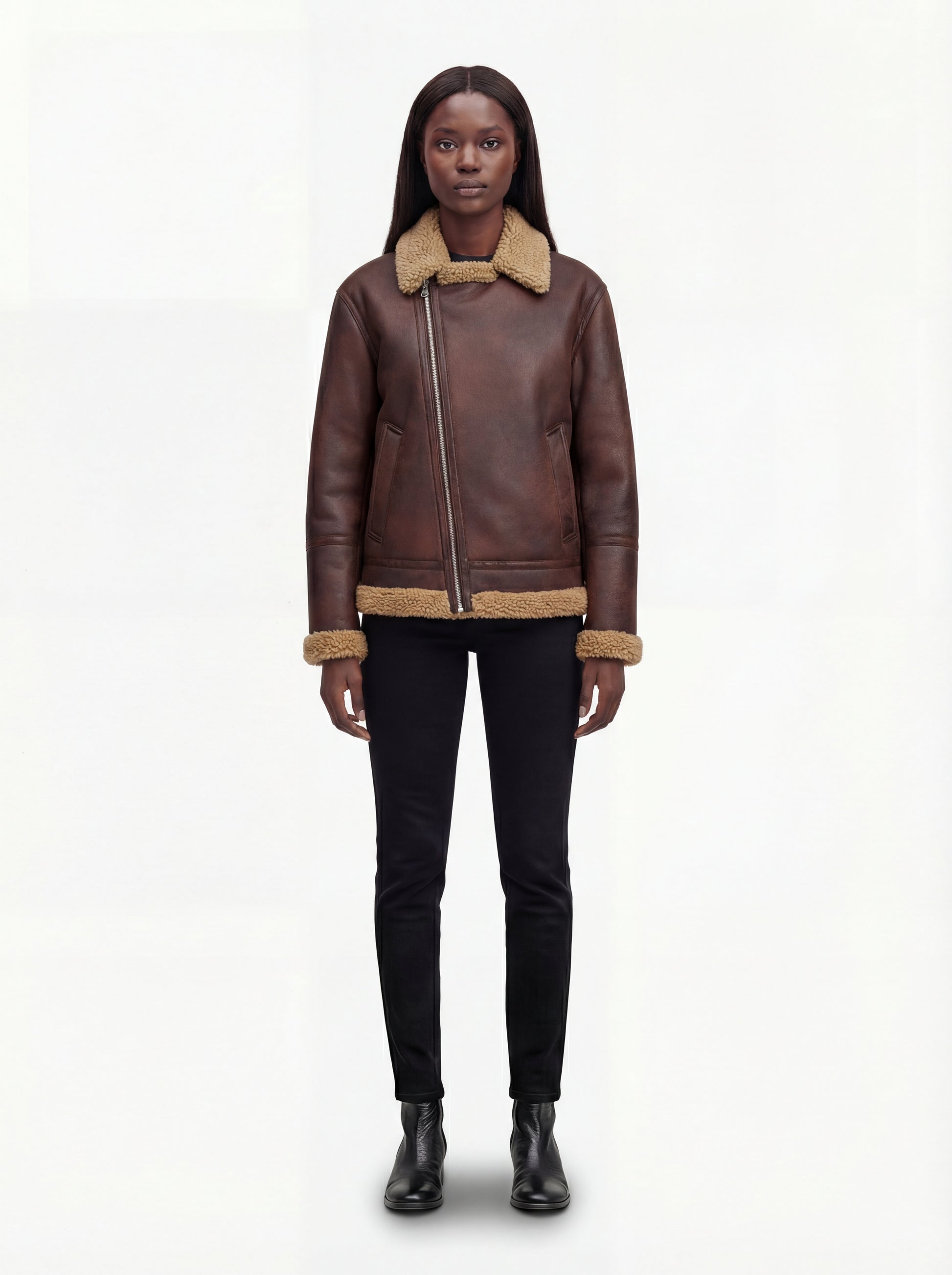 Female model wearing Maverick Sierra distressed aviator jacket, relaxed fit, styled with black skinny jeans and black leather boots. Maverick Sierra.