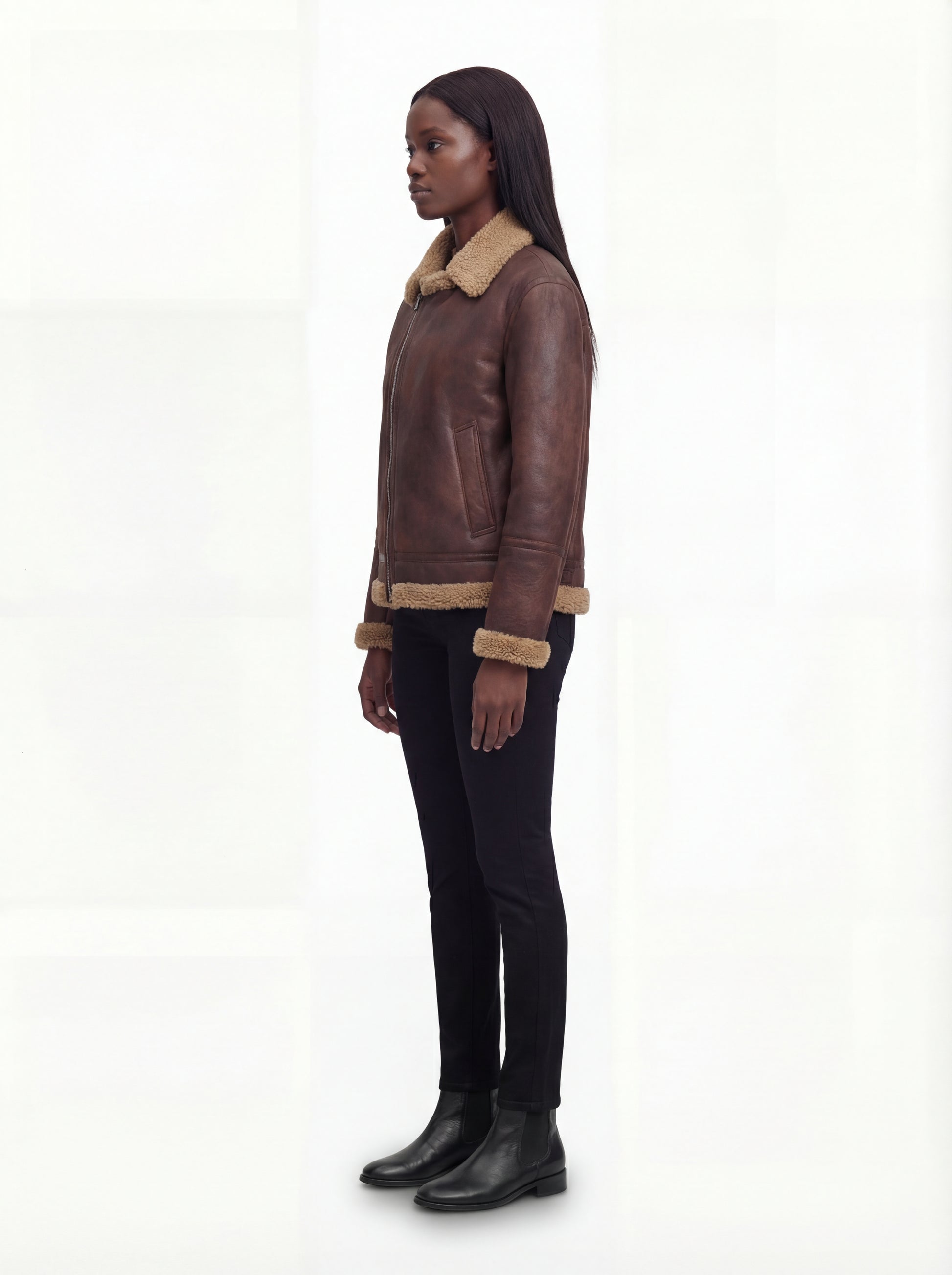 Side profile of Maverick Sierra aviator jacket showing straight sleeve cut and hip-length silhouette. Maverick Sierra.