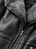 Macro shot of soft black leather texture contrasting with thick shearling wool and metal hardware on coat. The Genevieve by Maverick Jacket.