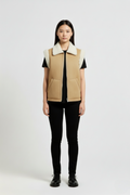 Female model wearing Maverick Elle shearling vest, relaxed fit, styled with black t-shirt and black skinny trousers. Maverick Jacket.