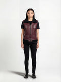 Female model wearing Maverick Valentina shearling vest, tailored fit, styled with black t-shirt and black skinny trousers. Maverick Jacket.