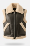 Women's black shearling biker vest with cream wool trim and triangular patch pockets, Front View. The Clara by Maverick Jacket.