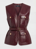 Women's burgundy leather utility vest with four patch pockets and gold button hardware, Front View. The Victoria by Maverick Jacket.