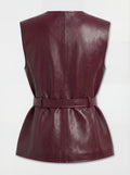 Rear view of burgundy leather utility vest showing vertical back seam and belted waist construction. The Victoria by Maverick Jacket.