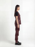 Side profile of Maverick Victoria utility vest showing sleeveless design and structured torso silhouette. Maverick Jacket.