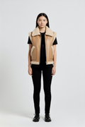 Female model wearing Maverick Clara leather vest, relaxed fit, styled with black skinny trousers and black leather derby shoes. Maverick Jacket.
