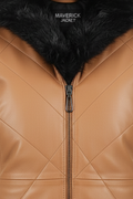 Macro shot of tan diamond quilted leather texture and black fur collar detail on vest. The Isabelle by Maverick Jacket.