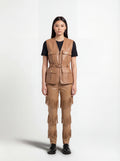 Female model wearing Maverick Victoria tan leather utility vest, tailored fit, styled with Maverick Stevie black leather fringe pants. Maverick Jacket.