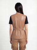 Rear view of female model wearing Maverick Victoria utility vest showing sleek back fit and belted waist styling. Maverick Jacket.