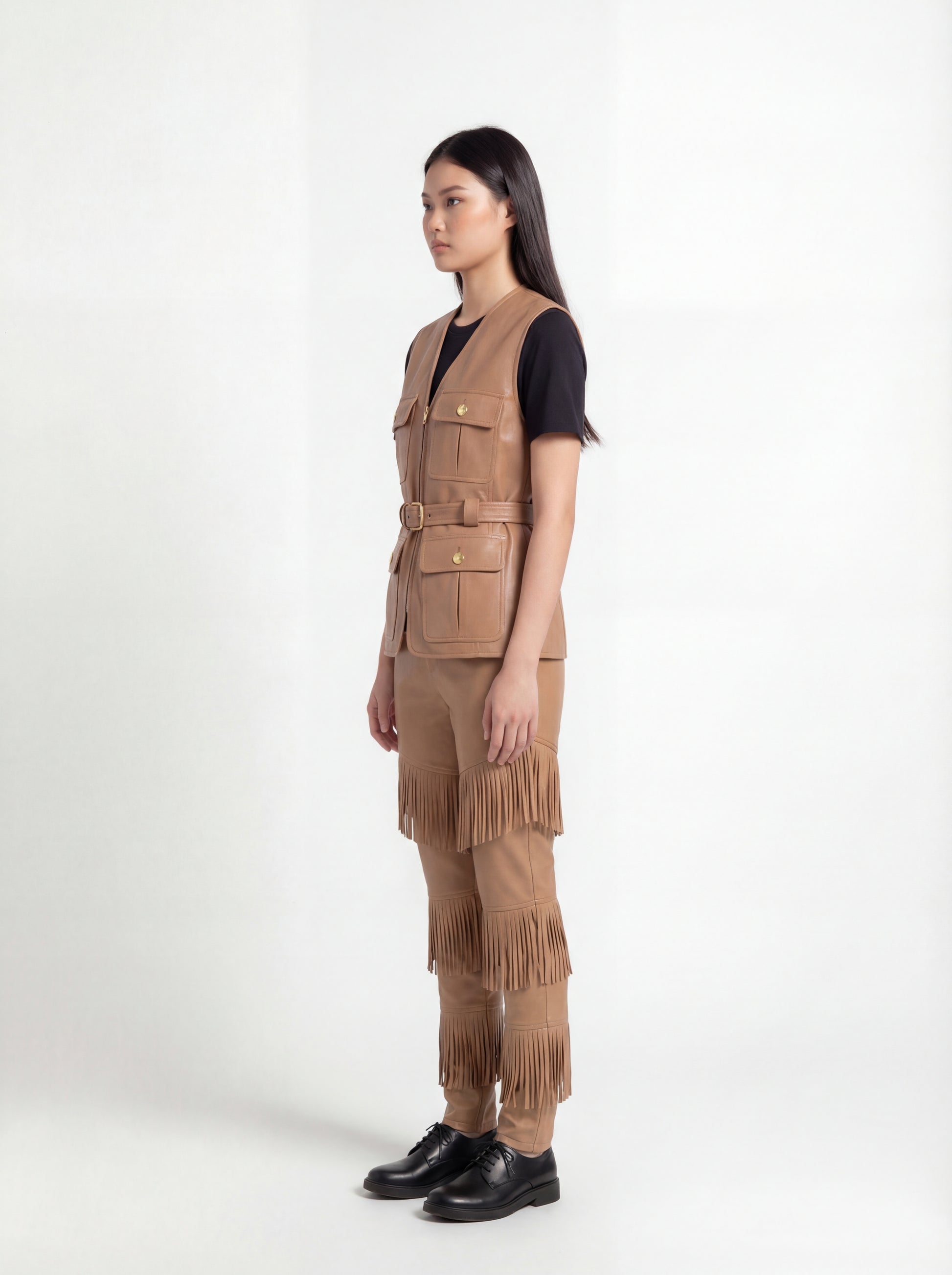 Side profile of Maverick Victoria utility vest showing sleeveless design and structured torso silhouette. Maverick Jacket.