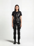 Female model wearing Maverick Victoria utility black leather vest, tailored fit, styled with Maverick Stevie black leather fringe pants. Maverick Jacket.