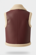 Rear view of burgundy shearling vest showing vertical center seam and thick cream hem. The Clara by Maverick Jacket.