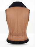 Rear view of tan shearling biker vest showing vertical center seam and black fur hem trim. The Valentina by Maverick Jacket.