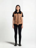 Female model wearing Maverick Valentina shearling vest, tailored fit, styled with black t-shirt and black skinny jeans. Maverick Jacket.