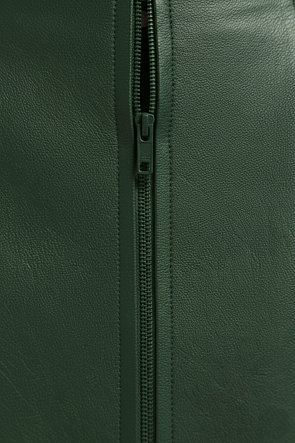 Women's green leather mini skirt with high waist fit and vertical paneling seams, Front View. The Orla by Maverick Jacket.