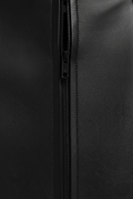 Macro shot of pebbled black leather texture and discreet zipper closure on mini skirt. The Orla by Maverick Jacket.